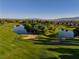 Beautiful shot of the golf course showcasing the manicured greens and water features at 5467 Eleganza Ave, Pahrump, NV 89061