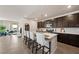 Modern kitchen featuring a large center island with seating and stainless steel appliances at 5467 Eleganza Ave, Pahrump, NV 89061
