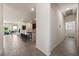 Open-concept living space with modern tile flooring and bright, natural light from sliding glass doors at 5467 Eleganza Ave, Pahrump, NV 89061