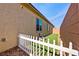 Side yard with narrow strip of grass, and a white picket fence at 5467 Eleganza Ave, Pahrump, NV 89061