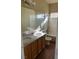 Bathroom featuring double vanity with granite counters, wooden cabinets and a shower-tub combo at 5758 Yellowcrest Ct, Las Vegas, NV 89113
