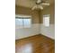 Bedroom featuring laminate floors, neutral walls, chair railing and bright windows at 5758 Yellowcrest Ct, Las Vegas, NV 89113