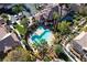 Aerial view of the community pool, spa, lush landscaping and surrounding buildings at 5855 Valley Dr # 1107, North Las Vegas, NV 89031