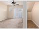 Cozy bedroom featuring carpet, ceiling fan and access to a closet with wood floor at 5855 Valley Dr # 1107, North Las Vegas, NV 89031