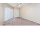 Bedroom with neutral walls, vertical blinds, carpet, and natural light at 5855 Valley Dr # 1107, North Las Vegas, NV 89031