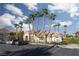Exterior view of the community building surrounded by palm trees and lush landscaping at 5855 Valley Dr # 1107, North Las Vegas, NV 89031