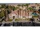 Community building with mature trees and manicured landscaping in a parking area at 5855 Valley Dr # 1107, North Las Vegas, NV 89031