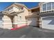 Multi-level condominium building showcases multiple garages and stucco exterior at 5855 Valley Dr # 1107, North Las Vegas, NV 89031