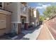 Townhome exterior featuring well-maintained landscaping and private walkway at 5855 Valley Dr # 1107, North Las Vegas, NV 89031