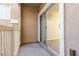 Outdoor patio with a sliding glass door and exterior wall texture at 5855 Valley Dr # 1107, North Las Vegas, NV 89031