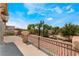 Picturesque view from the balcony overlooking lush landscaping and blue skies, creating a serene outdoor oasis at 5872 Revital Ct, Las Vegas, NV 89131