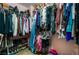 Walk-in closet with ample hanging space, shelving, and organization, ensuring a clutter-free and stylish wardrobe display at 5872 Revital Ct, Las Vegas, NV 89131