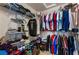 Walk-in closet with ample hanging space, shelving, and organization, ensuring a clutter-free and stylish wardrobe display at 5872 Revital Ct, Las Vegas, NV 89131