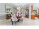 Elegant dining room featuring stylish furniture, a decorative mirror, and a chandelier at 5872 Revital Ct, Las Vegas, NV 89131