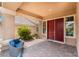 Welcoming front porch featuring a cozy seating area and a striking double-door entrance at 5872 Revital Ct, Las Vegas, NV 89131