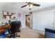 Home office featuring a desk, comfortable chair, and ample storage space with a window overlooking another room at 5872 Revital Ct, Las Vegas, NV 89131