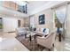 Bright living room showcasing an open floor plan, large windows, and contemporary decor at 5872 Revital Ct, Las Vegas, NV 89131