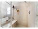 Contemporary shower with tile surround, built in bench and handheld shower. Next to a soaking tub at 5872 Revital Ct, Las Vegas, NV 89131