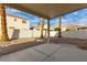 Charming covered backyard patio with low-maintenance desert landscaping and privacy walls at 5934 Reflection Point Ct, Las Vegas, NV 89110