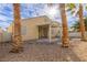 Relaxing covered backyard patio space surrounded by desert landscaping and stucco fencing at 5934 Reflection Point Ct, Las Vegas, NV 89110