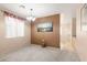 Dining room with a carpeted floor, light fixture and a painting on an accent wall at 5934 Reflection Point Ct, Las Vegas, NV 89110