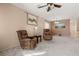 Cozy living room featuring neutral walls, plush carpeting, and comfortable reclining chairs at 5934 Reflection Point Ct, Las Vegas, NV 89110