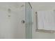 All-white walk-in shower features glass door, shower caddy and chrome hardware at 6059 Saddle Horse Ave, Las Vegas, NV 89122