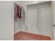 Walk-in closet featuring custom storage, rod and shelf space, with carpeted floors at 6059 Saddle Horse Ave, Las Vegas, NV 89122