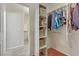 Well-organized walk-in closet with shelving and hanging storage with easy access to bathroom at 6059 Saddle Horse Ave, Las Vegas, NV 89122