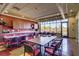 Spacious clubhouse featuring tables, chairs, and large windows offering views of the surrounding landscape at 6059 Saddle Horse Ave, Las Vegas, NV 89122