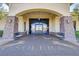 Grand entrance to Solera community center with stone accents and elegant landscaping at 6059 Saddle Horse Ave, Las Vegas, NV 89122