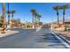 Gated entry with beautiful palm trees at Solera community by Del Webb at 6059 Saddle Horse Ave, Las Vegas, NV 89122