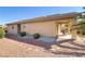 A side view of a well-maintained home featuring a cozy, covered patio at 6059 Saddle Horse Ave, Las Vegas, NV 89122