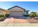 Welcoming single-Gathering home with a two-car garage and desert landscaping for easy maintenance and pleasing curb appeal at 6059 Saddle Horse Ave, Las Vegas, NV 89122
