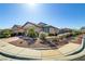 Single-story home boasting desert landscaping, well-maintained facade, and inviting curb appeal on a sunny day at 6059 Saddle Horse Ave, Las Vegas, NV 89122