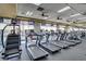 Well-equipped gym featuring treadmills and other exercise machines with multiple TV screens at 6059 Saddle Horse Ave, Las Vegas, NV 89122