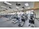 Spacious gym with rows of modern treadmills and elliptical machines for a complete workout at 6059 Saddle Horse Ave, Las Vegas, NV 89122
