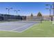 Well-maintained tennis court with new net and lighting for evening play at 6059 Saddle Horse Ave, Las Vegas, NV 89122