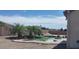 Pool with rock design, palms and a concrete surround with rock landscaping at 6120 Matisse Ave, Las Vegas, NV 89131