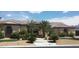 Attractive stucco home featuring a tile roof, stone accents, and desert landscaping at 6120 Matisse Ave, Las Vegas, NV 89131
