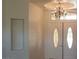 Elegant foyer featuring decorative double doors and a decorative chandelier at 6120 Matisse Ave, Las Vegas, NV 89131