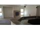 Kitchen showcasing granite countertops, gas fireplace, and breakfast bar at 6120 Matisse Ave, Las Vegas, NV 89131