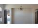 Spacious room with chandelier and entryways into other rooms of the home at 6120 Matisse Ave, Las Vegas, NV 89131