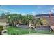 Backyard pool with tropical palms and steps leading into the water at 6120 Matisse Ave, Las Vegas, NV 89131