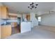 An open layout showcases a breakfast bar, gas range and ample counter space, ideal for entertaining at 6134 Pine Villa Ave # 103, Las Vegas, NV 89108