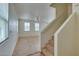 Neutral staircase with carpet runner, leading to the upper level at 6134 Pine Villa Ave # 103, Las Vegas, NV 89108