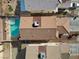 Aerial view of a home showcasing a backyard pool and spa in a well-maintained residential neighborhood at 6328 Brianna Peak Ct, Las Vegas, NV 89142