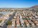 An aerial view of a densely populated residential neighborhood with beige homes and well-maintained streets at 6328 Brianna Peak Ct, Las Vegas, NV 89142