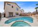 Inviting backyard featuring a sparkling pool, spa, and rock waterfall at 6328 Brianna Peak Ct, Las Vegas, NV 89142