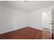 Empty bedroom featuring white walls and a dark wood floor at 6328 Brianna Peak Ct, Las Vegas, NV 89142